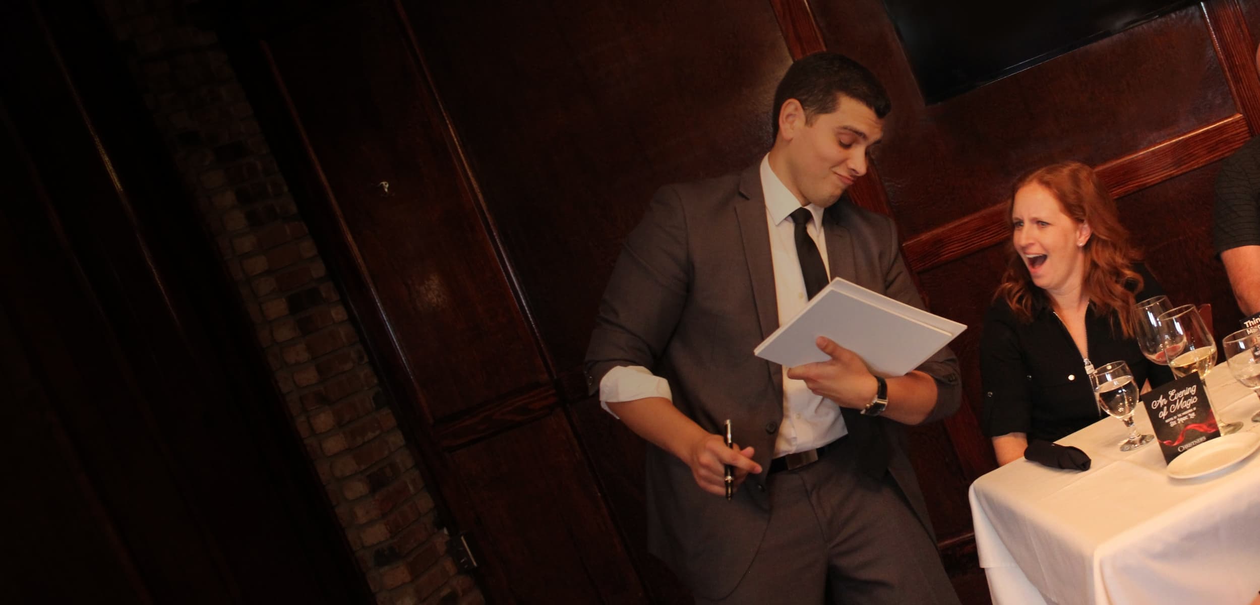 Mentalist performing strolling mentalism at a cocktail reception